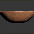 Artisanal Hand Carved Orange Clay Bowl With Intricate Decorative Surface Patterns And Smooth Edges