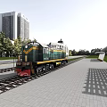 Green Train With Yellow Stripes At Urban Station Platform Near Tall Buildings And Trees