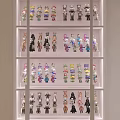 Organized Action Figure Display Cabinet With Colorful Collectibles And Multiple Shelves