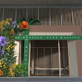 Pearl Mansion Event Entrance With Colorful Floral Decorations And Green Frame