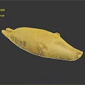 Yellow Bear Shaped Decorative Object With Silver6 Text On Surface