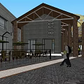 Industrial Factory Building Red Brick Black Roof Glass Garage Door and Outdoor Area People Walking