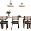 Modern Wooden Tea Table And Rattan Chairs With Dark Cushions Decorative Vase And Hanging Lights