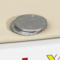 Two Silver Coins Stacked on Beige Fabric for Daily Living Supplies