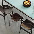 Modern Dining Table Set With Light Blue Tabletop Dark Chairs And Fruit Basket