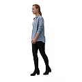 A Woman Wearing Striped Tank Top Denim Shirt Black Pants And Boots