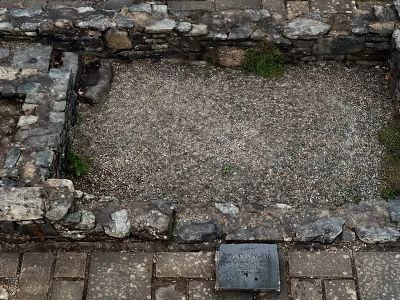 Old Stone Wall Enclosed Space Featuring Gravel Ground Brick Paving and Small Grass 3d model