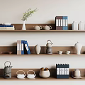 Elegant Tea Sets Display On Shelves With Books Vase Plant Teapots And Cups