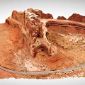 Red Rock Desert Terrain With Winding Road And Canyon Landforms