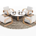Round Dining Table with Four White Chairs Wooden Armrests and Decorative Items on Woven Rug