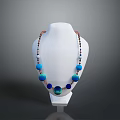 Elegant Fashion Necklace With Blue Green Beads On White Mannequin Against Dark Background
