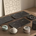 Modern Kitchen Appliances On Wooden Countertop With Induction Cooktops And Pots