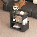 Modern Black Side Table With Flowers Coffee Cup Wine Bottle Radio And Books On Wheels