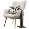 Modern Leisure Chair With Plush Fabric Wooden Legs Abstract Pillow And Striped Throw Blanket