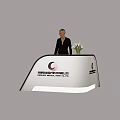 Curved Exhibition Reception Desk With Receptionist And Flower Arrangement In Jakarta Indonesia