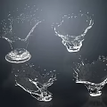 Transparent Water Fountain With Four Different Splash Shapes On Black Background