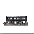 Burned Building Exterior With Damaged Walls Broken Windows Fallen Bricks And Debris At Entrance