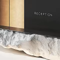 Modern Stone Reception Desk With Illuminated Sign And Warm Lighting Design