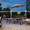 Scenic Wooden Deck Patio With White Railings Dining Table Umbrella Flowers And Twilight Sky