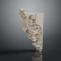 White Carved Decorative Corner With Intricate Plant And Floral Motifs