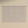 Elegant Gray Textured Curtain Hanging On Rod Against Beige Background