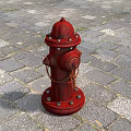 Red Fire Hydrant Essential Emergency Safety Equipment On Stone Paved Ground