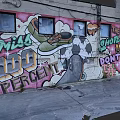 Urban Building Exterior With Colorful Graffiti Murals 100 Percent Text And Shoe Graphics