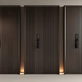 Dark Wooden Security Doors with Textured Panels Black Locks and Warm Base Lighting