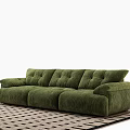 Green Velvet Three Seater Sofa With Tufted Design On Black And White Checkered Rug
