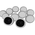 White Spherical Food Some Cut Open With Black Inner Filling On White Surface