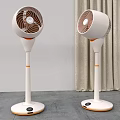 Two Air Cooler Fans with White and Orange Design Standing in Modern Room