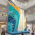 Indoor Rock Climbing Wall With Colorful Holds In Multi Level Shopping Mall