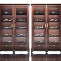 Dark Wooden Display Cabinets with Glass Doors and Shelves Holding Model Aircraft