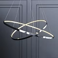 Modern Intersecting Circular Ring Chandelier With Glowing LED Lights And Sleek Metal Frame