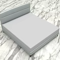 Modern Double Bed with Gray Upholstered Headboard and Light Colored Mattress on Marble Patterned Floor