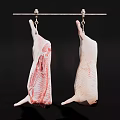 Two Raw Meat Carcasses Hanging On Metal Rod With Hooks Against Black Background