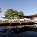 Relaxing Lakeside Garden Landscape With Wooden Deck Canopy And Water Reflection