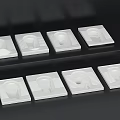 Multiple White Square Toilet Components Neatly Arranged On Black Background 3d model