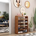 Wooden Shoe Cabinet With Multiple Shelves Various Shoes Green Plants And Decorative Wall Art
