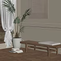 Wooden Bench With Gray Cushion And Green Plant In Bright Indoor Space