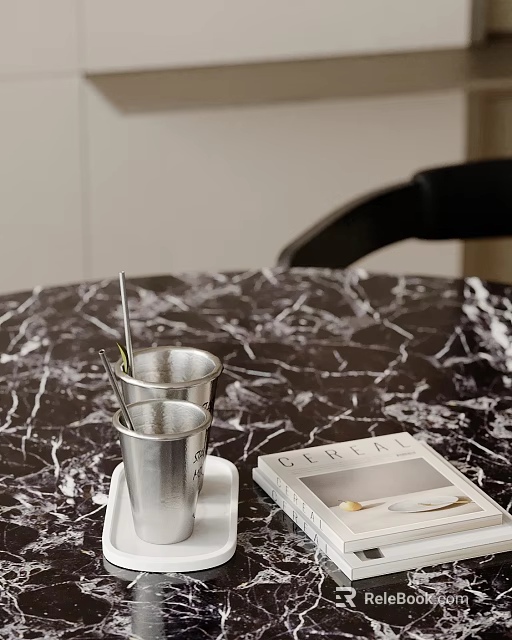 Decorative Ornament Set With Silver Cups Straws And Book On Marble Tabletop 3d model 