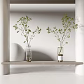 Green Branches in Two Vases on Light Colored Shelf with White Wall Arch Background