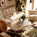 Cozy Living Dining Area Interior With Beige Sofa Armchair Coffee Table Green Plants Sunlight