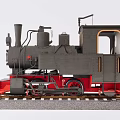 Vintage Steam Train Model Black Body And Red Base On Railway Track