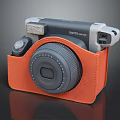 Instax Mini 12 Instant Camera In Orange Leather Case With Round Lens And Portable Design