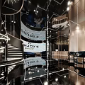 Modern Shop Front Desk Interior Design With Glass Decor And Warm Lighting