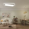 Modern Living Dining Room Interior With White Sofa Green Chair Coffee Table And Decorative Painting