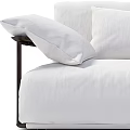 Modern White Three Seater Sofa With Black Frame Fabric Upholstery And Multiple Cushions
