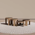 Three Wooden Round Side Tables On Woven Rug With Small Plant