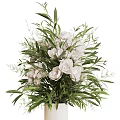 Elegant White Flower Arrangement in White Vase with Fresh Green Leaves
